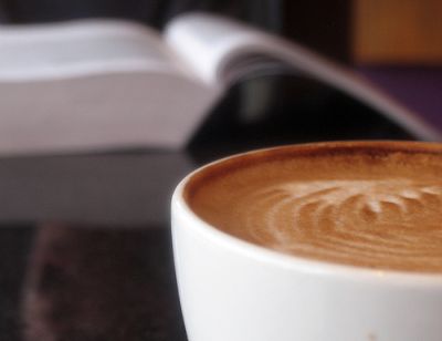 Espresso cup on an open book