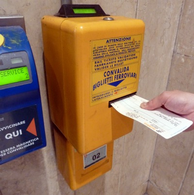 A ticket validation machine in an Italian station